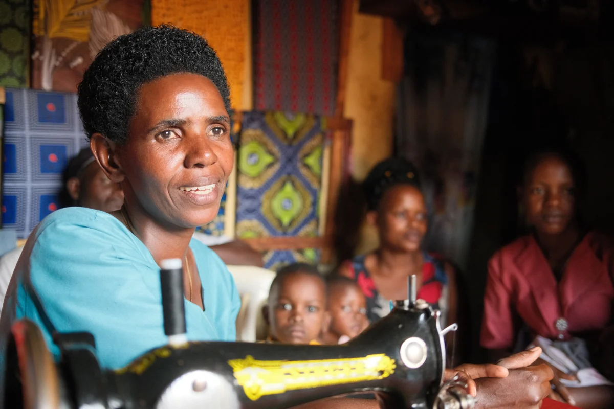 Pastor Edvina at her tailoring business, January 2026. She joined the partnership program in 2026.