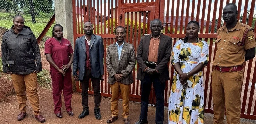 The visiting team with prison staff at Kibaale, March 29, 2026.