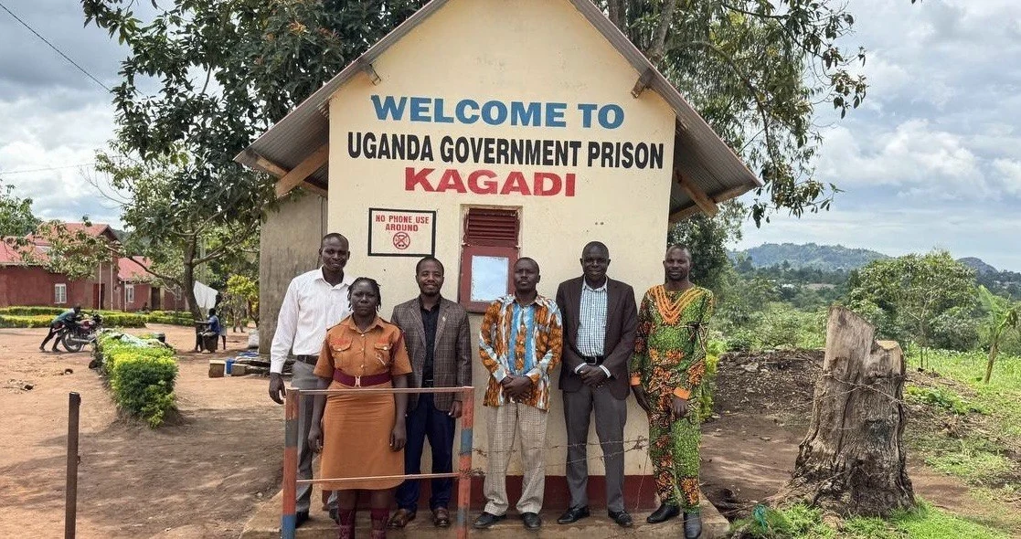 The PSM team at Kagadi Prison’s entrance, April 25, 2026.
