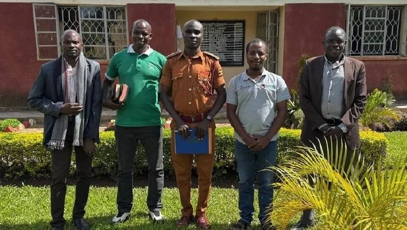 The visiting team with prison staff at Kakumiro, May 2, 2026.
