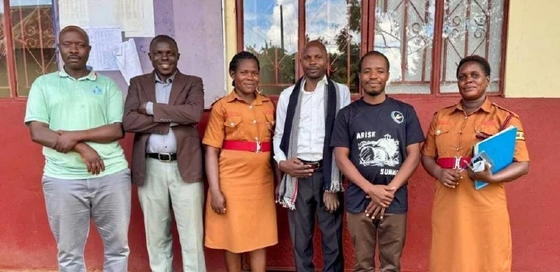 The visiting team with prison staff at Myanzi, May 3, 2026.