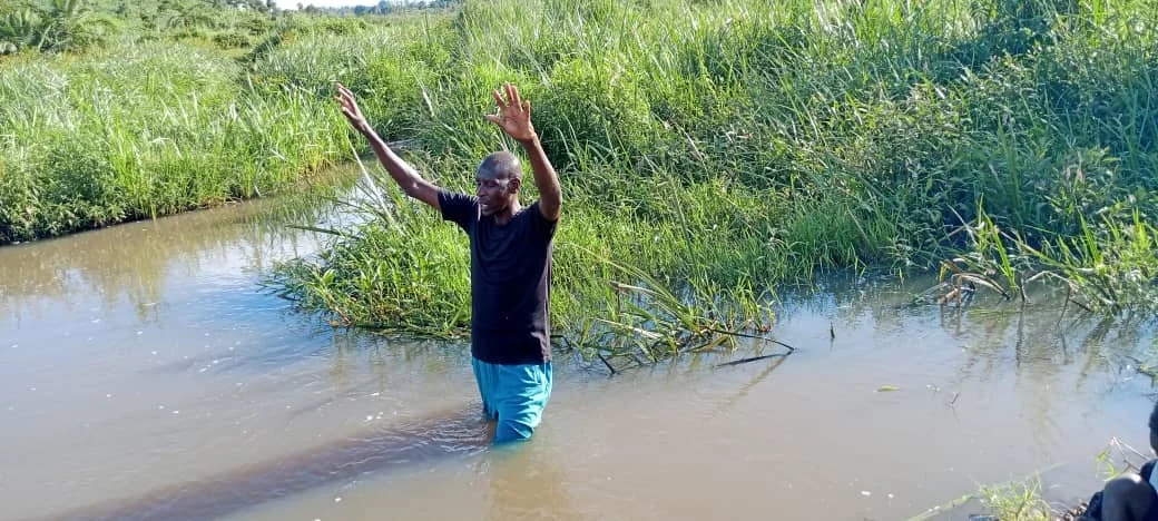 A baptism photograph included with the Kakindo conference update, October 2023.