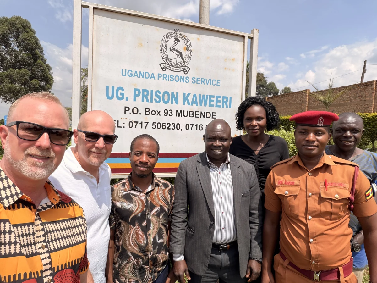 Team members with prison staff at Kaweeri during the January 2026 visit.