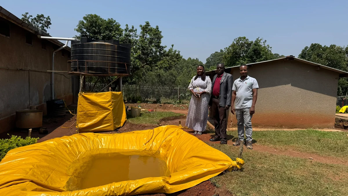 The team beside the baptism pool at Kibaale, July 19, 2026.